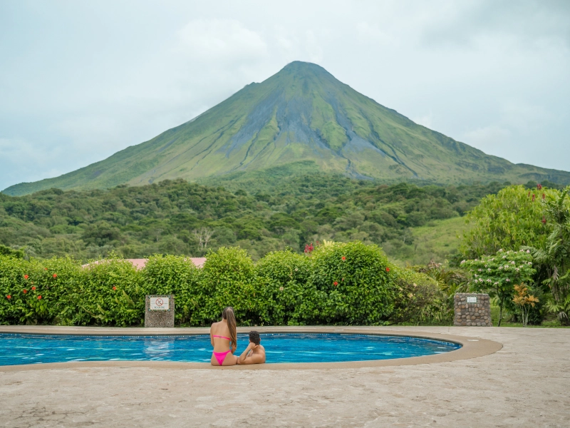 happy couple in scuba gear on honeymoon dive in costa rica